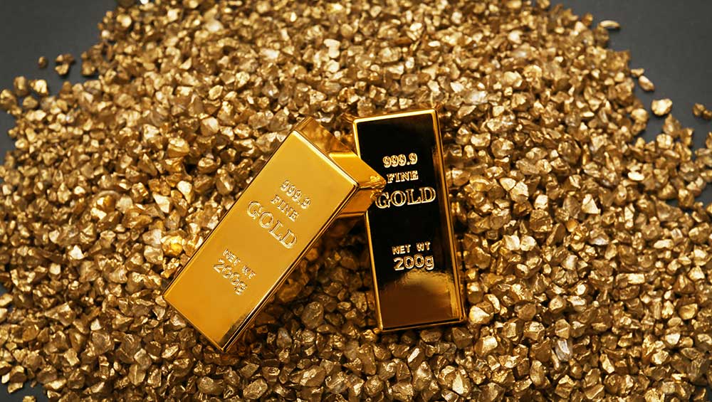 Gold bars on nugget grains background, close-up